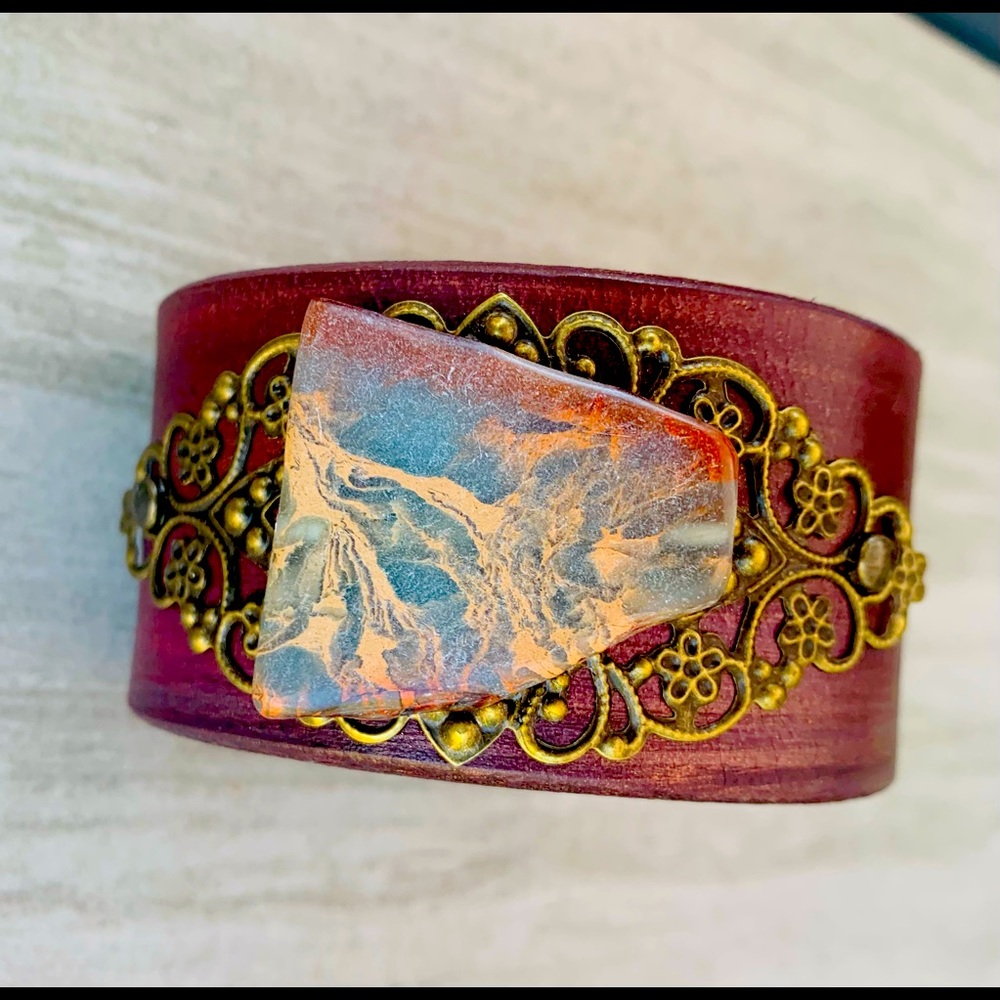 Recycled belt cuff with marbled stone.